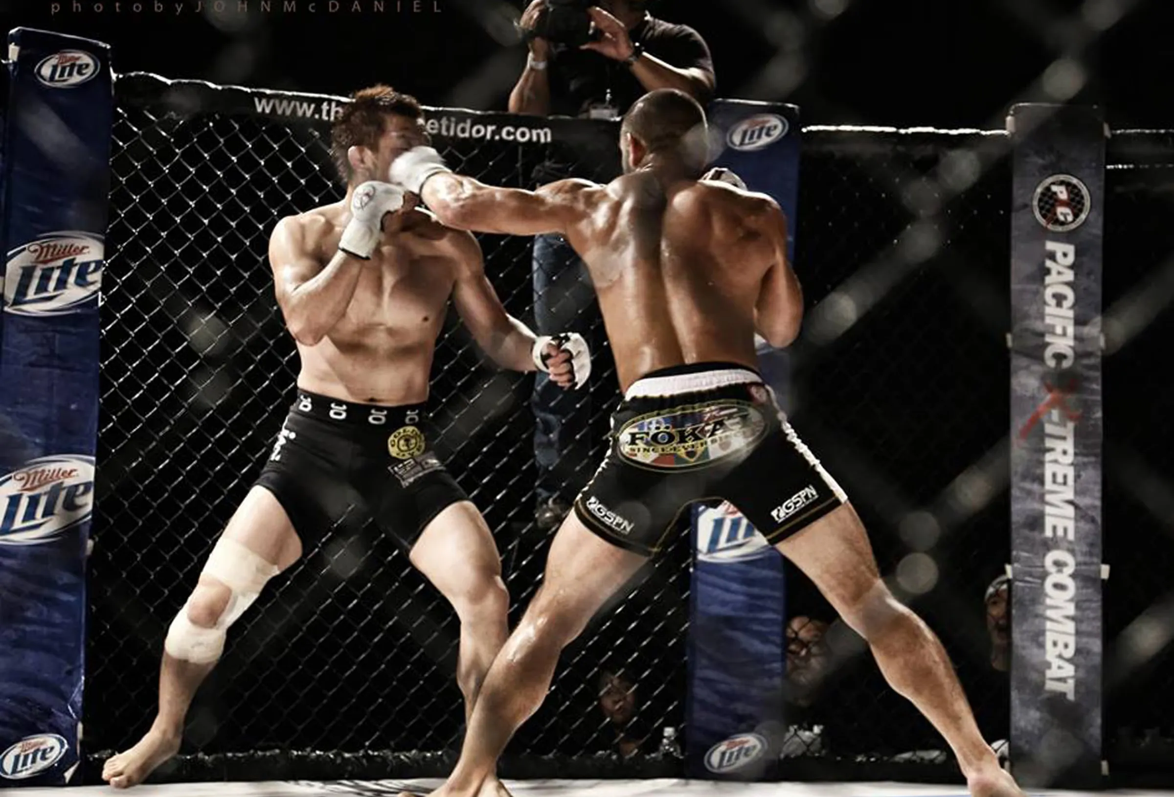 Frank Camacho landing a strike during an MMA cage fight